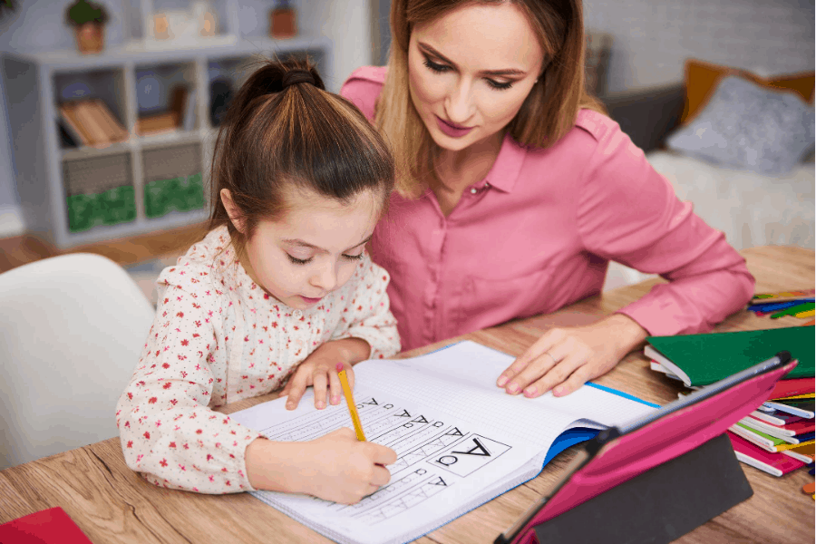 woman homeschooling daughter